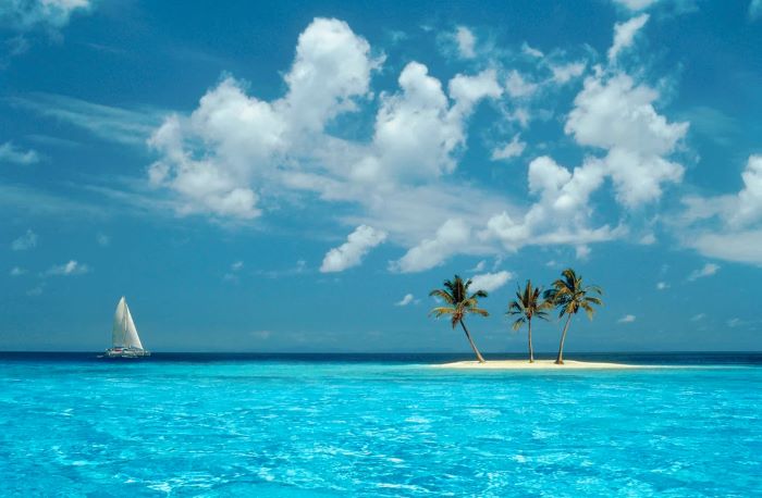 Windows XP Azul wallpaper showing a tiny tropical island with palm trees